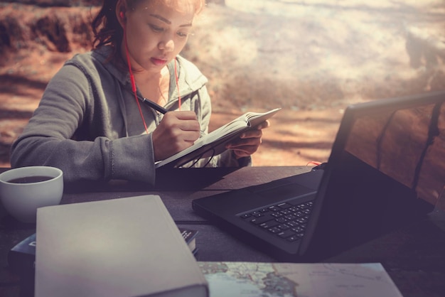 A close-up shot of a student filling out the FAFSA form on a laptop, highlighting the fields related to income and assets, with a focus on accuracy and attention to detail.