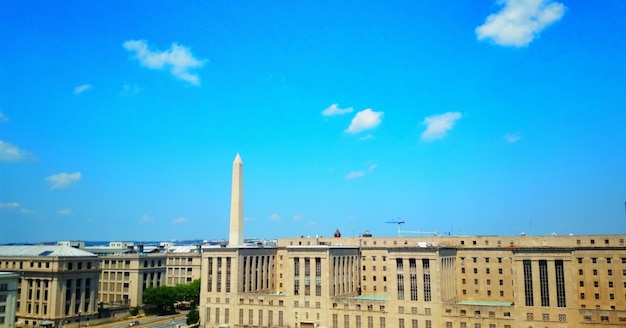A photograph of the U.S. Federal Reserve building in Washington, D.C., with a clear blue sky in the background to emphasize its importance to the U.S. economy.
