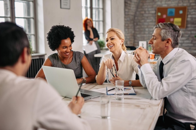 A diverse group of people sitting at a table, with a financial advisor, reviewing retirement documents and discussing strategies to claim unclaimed benefits, emphasizing teamwork and professional guidance.
