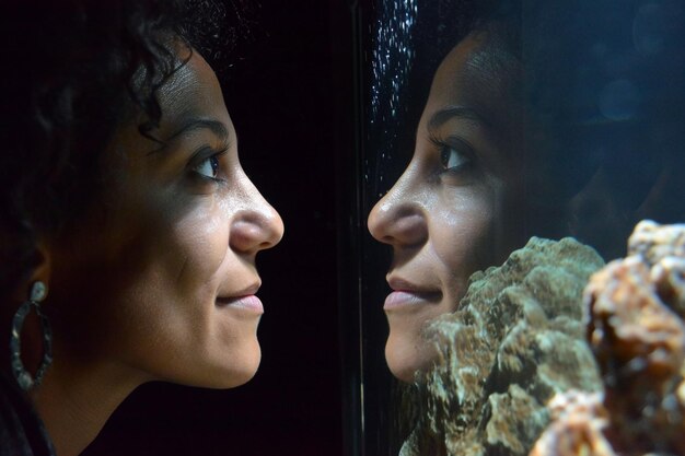 A split image showing contrasting viewpoints on affirmative action, with one side depicting a diverse group of students and the other side showing a student holding a sign that reads