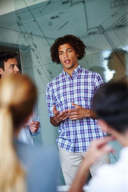 A close-up of a person confidently presenting a project in a training session, showcasing improved communication skills.